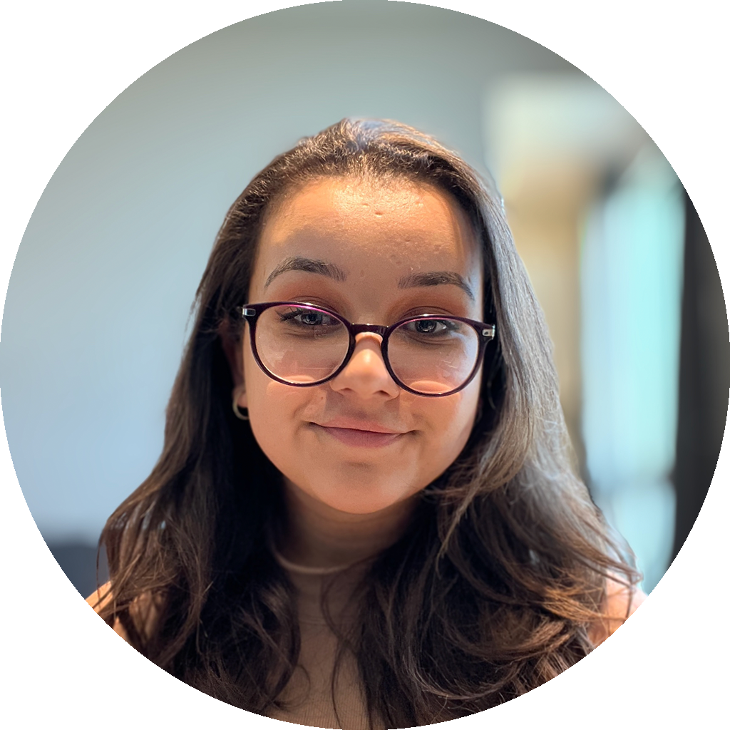 Portrait picture of Amanda, a Latina woman with dark hair and glasses.