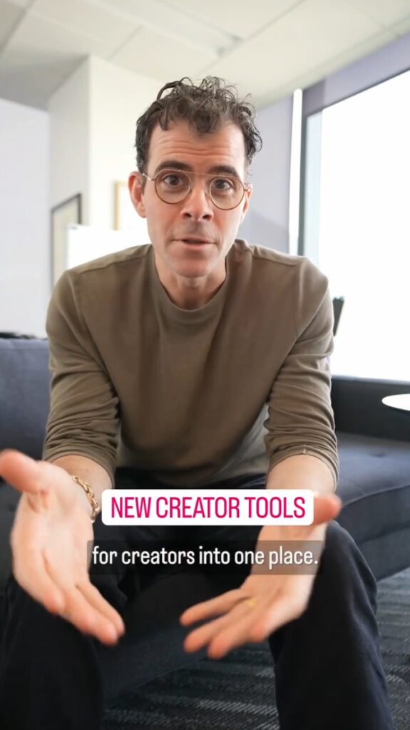 Mosseri sits at the edge of a sofa explaining Instagram's new Best Practice Hub. There is a link on the screen to find them and part of a caption that reads: "for creators into one place."