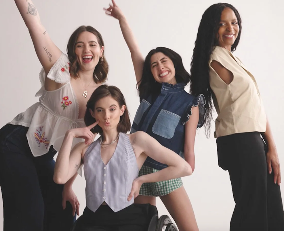 A group of disabled women pose happily as they model Anthropologie's new adaptive fashion range.