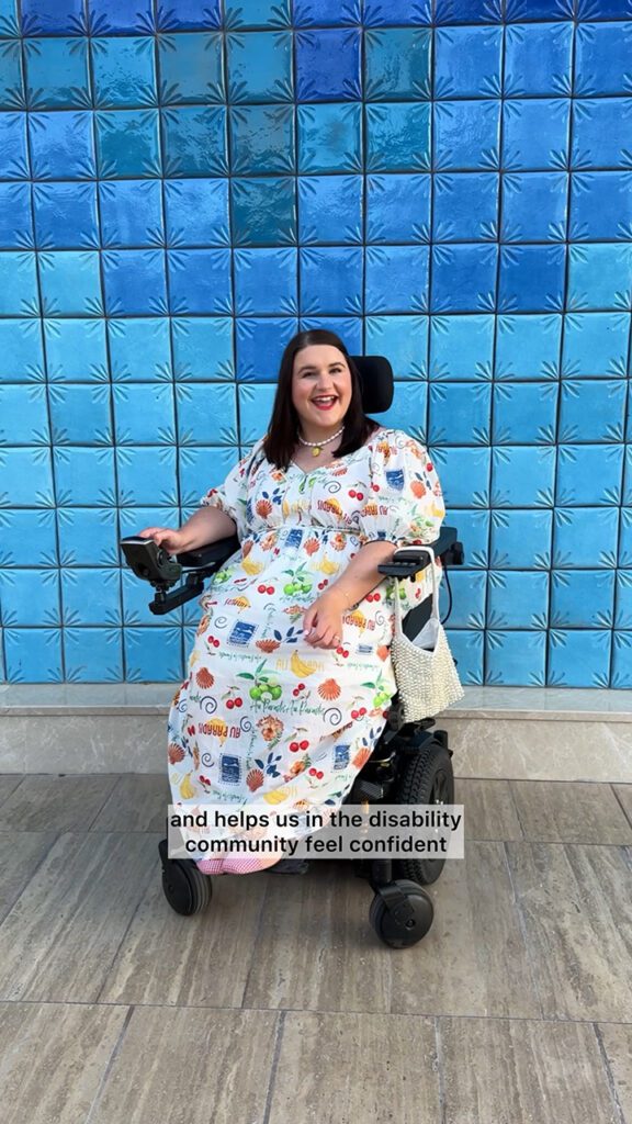 Sophie poses cheerfully in front of a blue tiled wall while away on a TUI holiday.