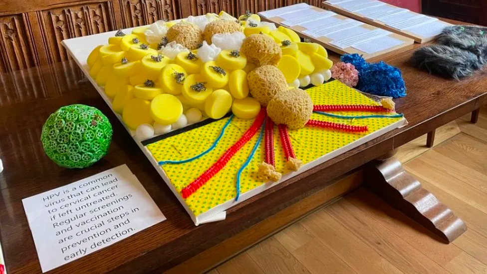 A stand at the art exhibition showing a science project with tactile elements.